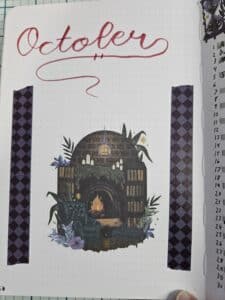 Single journal page that says October at the top with a central picture of a dark, cozy den and diamond patterned tape down the sides